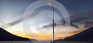 view of the sea and the island at sunset in the tidore islands photo